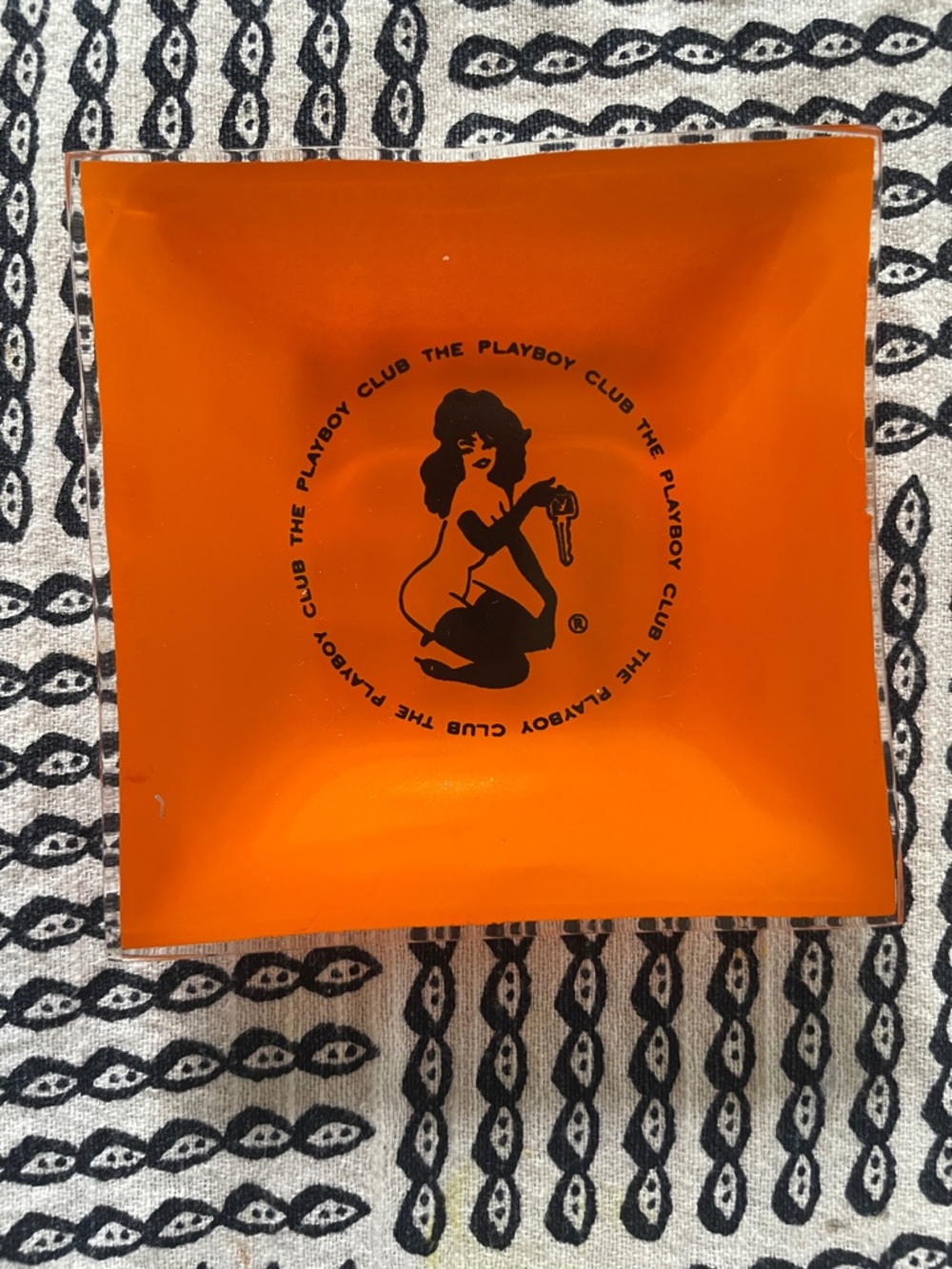 PLAYBOY Orange trinket dish or ashtray with Black Playboy Club Graphic